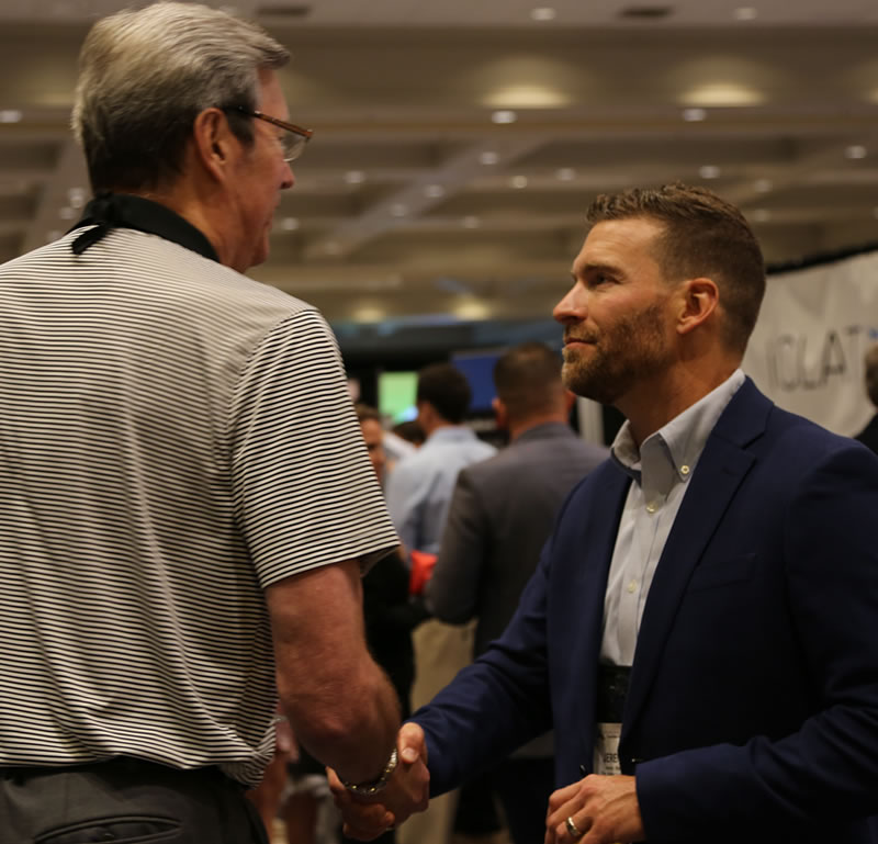 Jeremy Stelter visits with a colleague at the 2019 NCPP Conference.