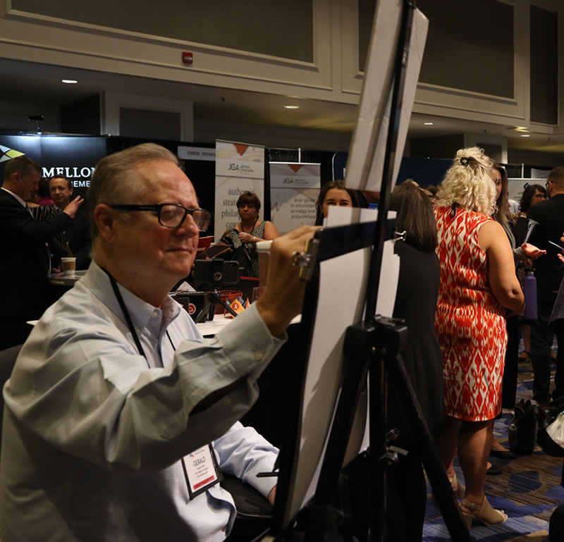 Caricature artist, Gerald Atkin, does his magic at the 2019 NCPP Conference.