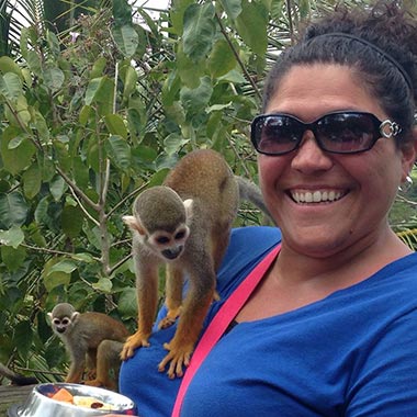 Wendi with a monkey on her shoulder