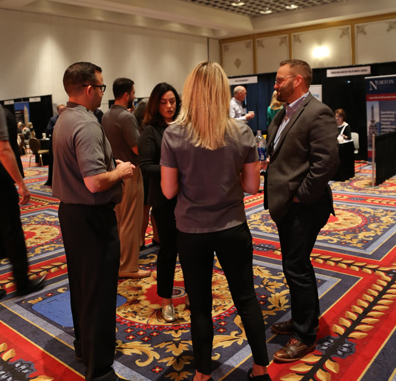 Stelter staff reconnect with a client at the 2018 CGP Conference.