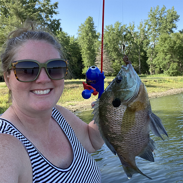 Jessica with a fish she caught.