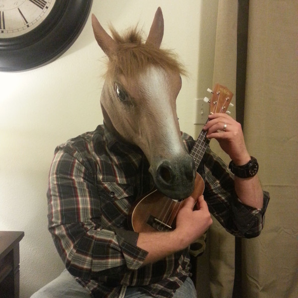 Justin wearing a horse head mask